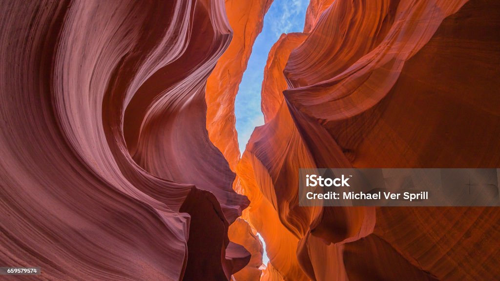 Looking up inside a canyon slot in Arizona Beautiful colors of Lower antelope canyon in Arizona Looking Up Stock Photo