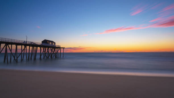 istock Belmar fishing pier at sunrise 659609078
