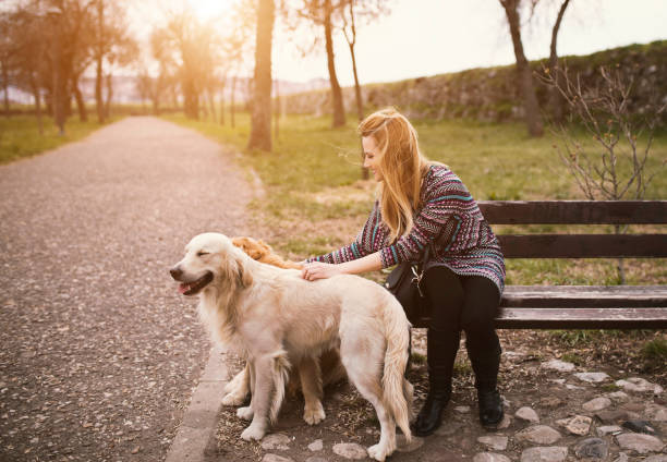 istock Beautiful young woman and her dog 659623922