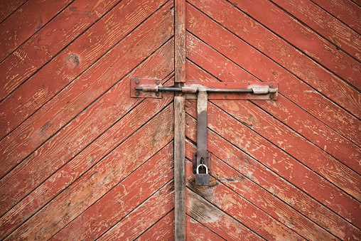 The old door locked with a padlock hanging brackets. Set of backgrounds. Ukraine