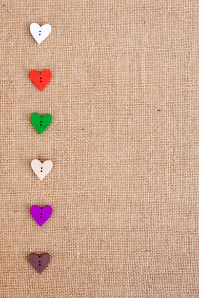 istock Background - burlap hessian with heart shape button decoration 659635716