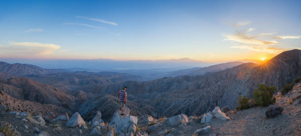 istock Man watching a sunset from Keys View in California 659640894