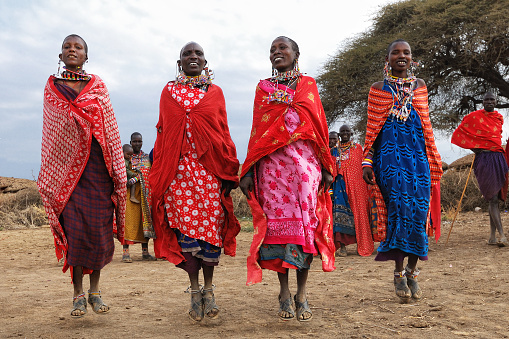 MASAI MARA, KENYA â AUGUST 23: Group of unidentified African women from Masai tribe show a traditional Jump dance on August 23, 2010 in a local village near Masai Mara National park.