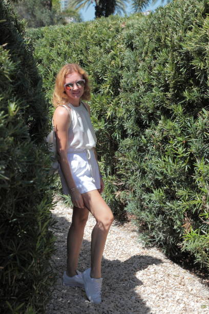 istock Woman in the plant labyrinth. 659643244