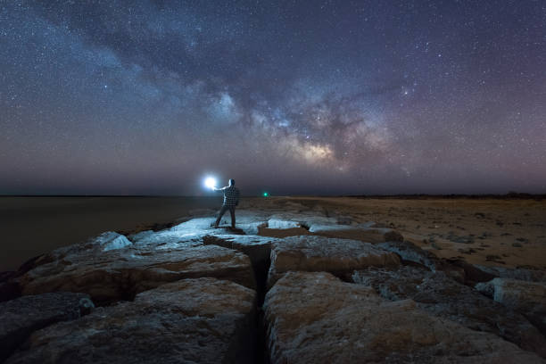 istock Man standing on Barnegat Jetty watching the Milky Way 659653772
