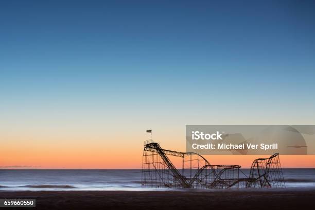 Sunrise Behind The Iconic Jet Star Roller Coaster After Hurricane Sandy Stock Photo - Download Image Now