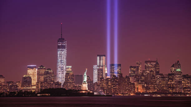Tribute in Light from New Jersey Tribute in light capturing the Freedom Tower, Statue of Liberty and the lights from New Jersey. one world trade center photos stock pictures, royalty-free photos & images