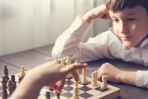 istock Boy and girl playing chess 659691344