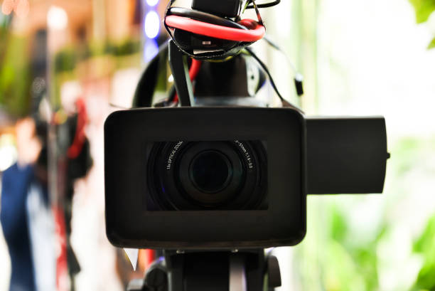 istock Professional video camera on location.Focus is on the Len 659698208