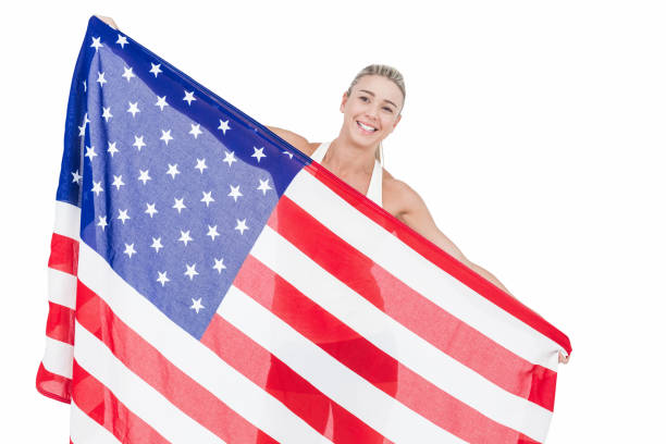 istock Female athlete holding American flag 659703166