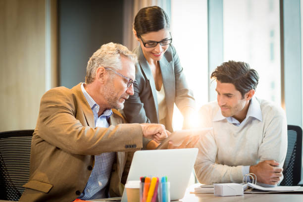 istock Business people discussing over digital tablet 659703912