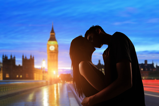 silhouette of couple is kissing with big ben