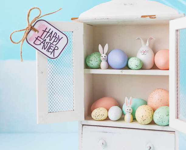 istock Easter collection of eggs and rabbits in white cabinet 659809060