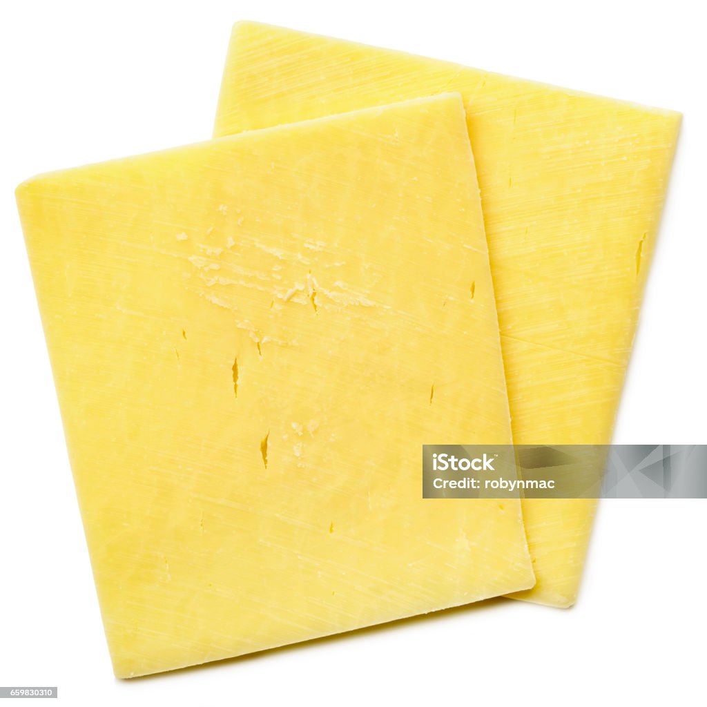 Cheese Slices Isolated on White Top View Two cheese slices isolated on white, top view.  Healthy natural cheddar. Cheese Stock Photo