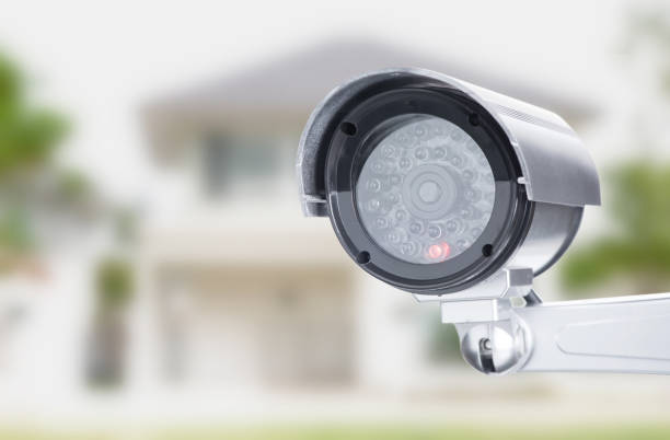 CCTV camera ccd lens security  on house home blure background