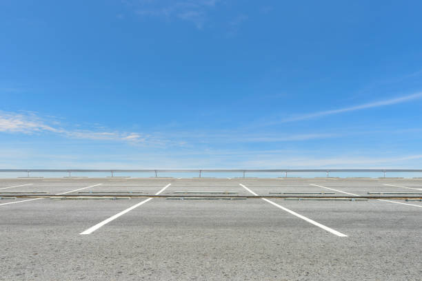 istock Empty parking lot against a beautiful blue sky 659869618