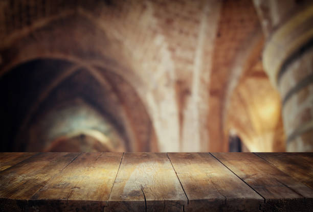 istock table in front of abstract blurred church interior background 659885458
