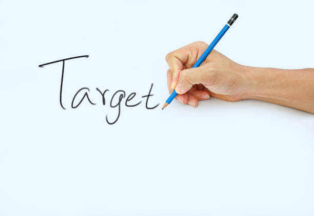 istock Hand holding a pencil on a white paper background. 659886498
