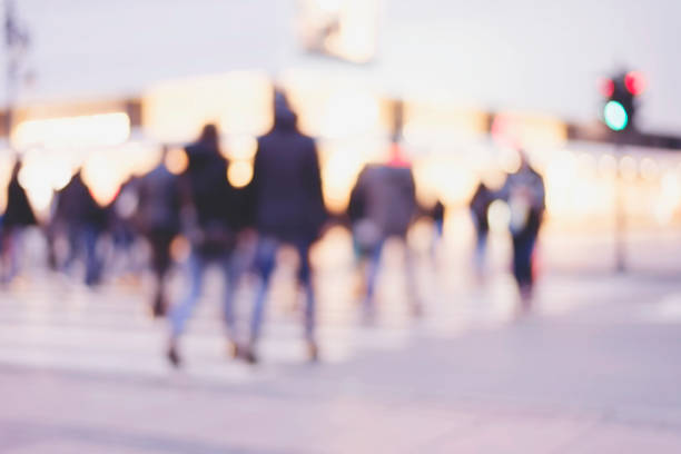 istock unrecognizable silhouettes of people walking on a street 659891404