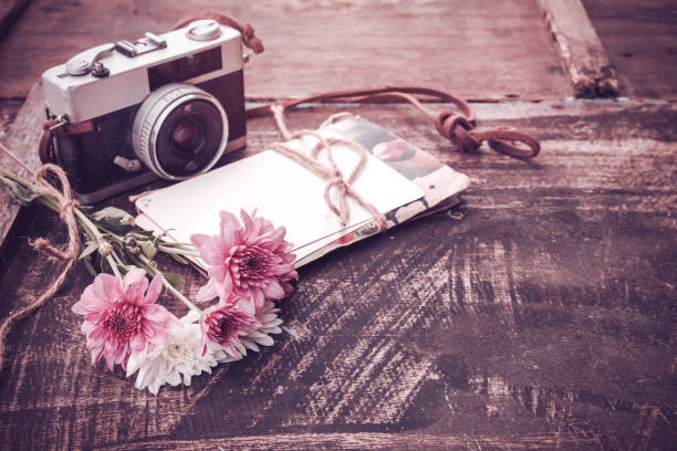 istock camera with bouquet of flowers 659897954