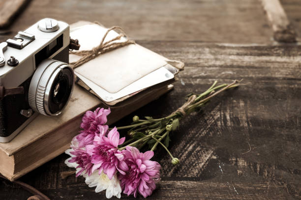 istock camera with bouquet of flowers 659899398