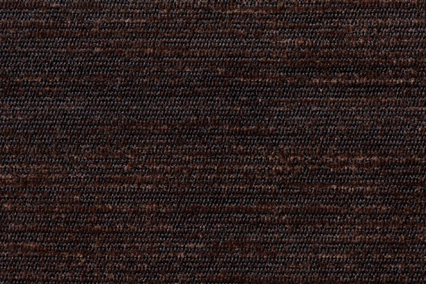 istock Dark brown background from soft textile material. Fabric with natural texture. 659907078