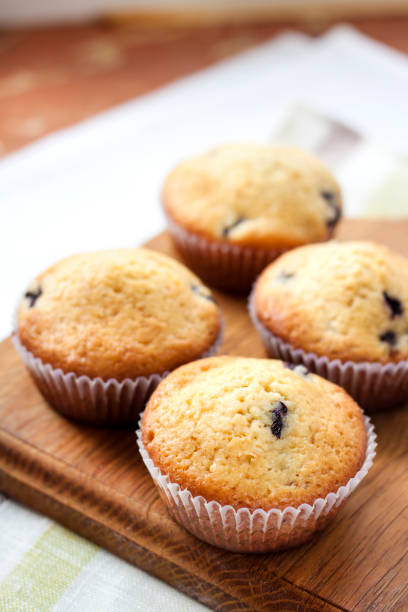 istock Homemade muffins with blueberries on a wooden board 659907722