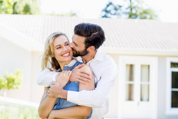 istock Young man kissing on womans cheek 659916088