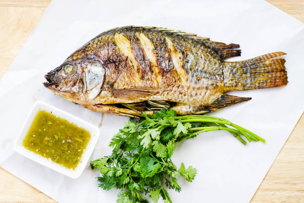 istock Grilled fish and spicy seafood sauce 659930760