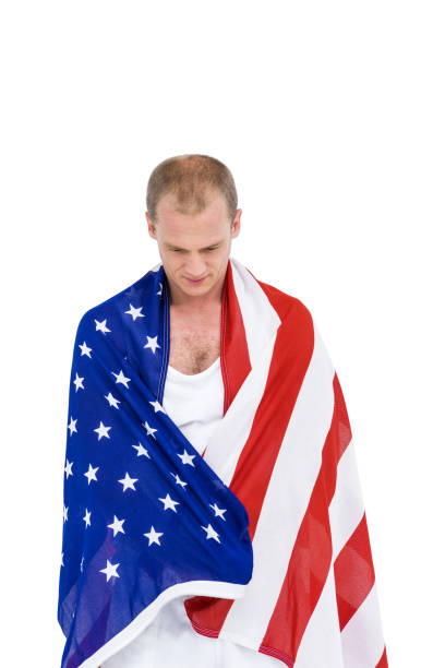 istock Athlete with american flag wrapped around his body 659941422
