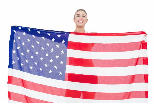 istock Female athlete holding American flag 659948920
