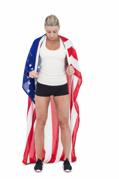 istock Female athlete holding American flag 659951698