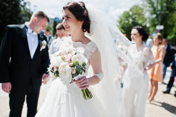 istock Soft focus on wedding bouquet at hand of bride. 659963858