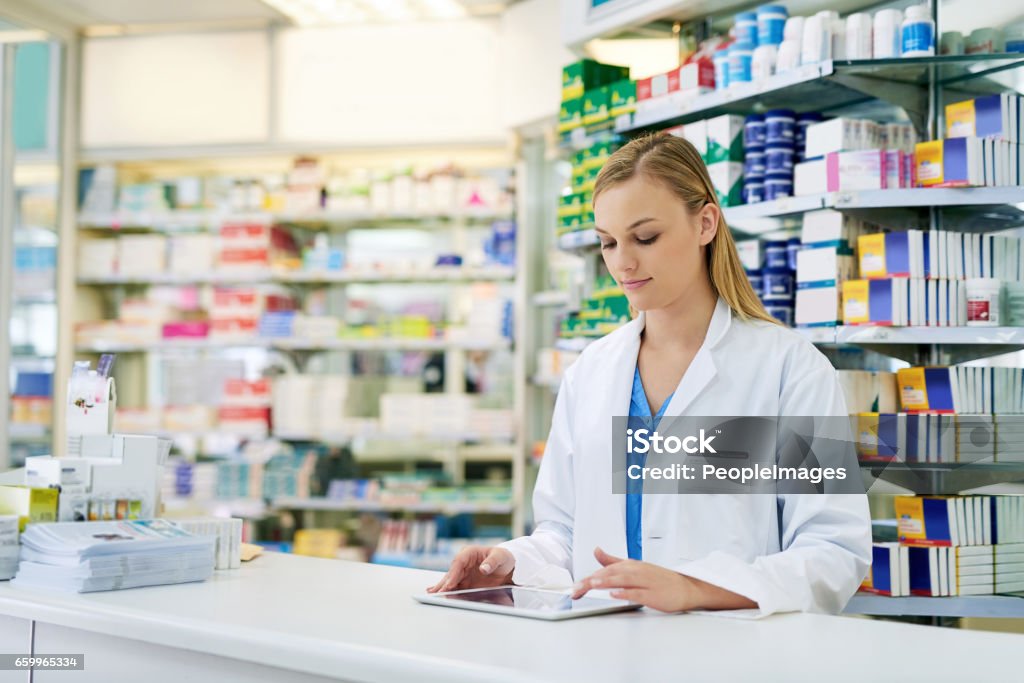 Pharmacist Multitasking Simplifying Pharmaceutical Tasks With Smart Technology Stock Photo ...