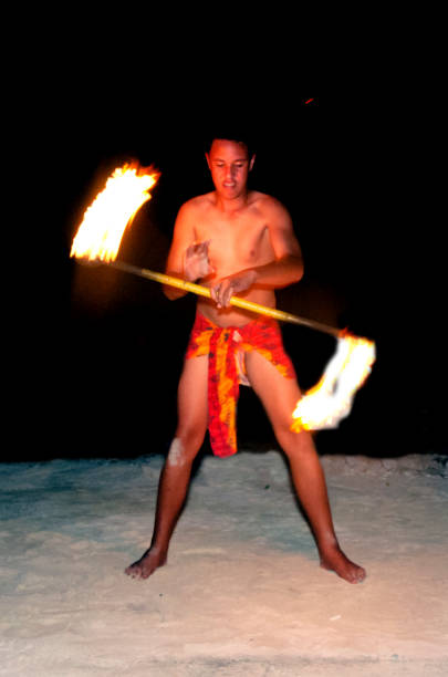 istock Young Polynesian Pacific Island Tahitian Fire Man Dancer 659982042