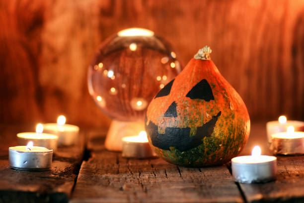 istock pumpkin head and candles decor 659982440