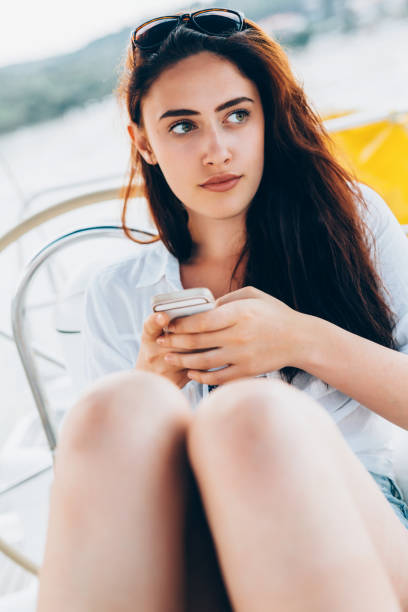 istock Beautiful woman texting 659990556
