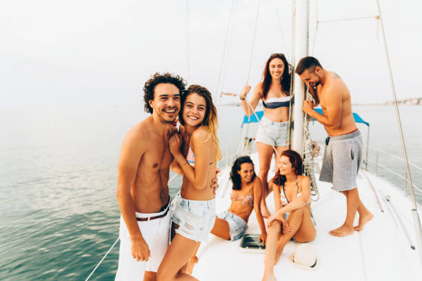 istock Happy friends on a yacht 659995100