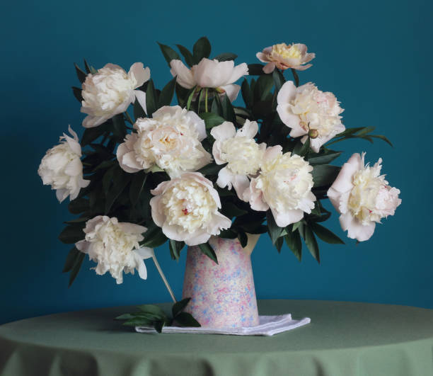 istock still life with white peonies in pitcher 660013488