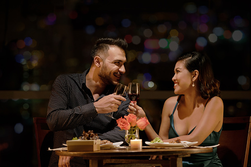 Couple in love enjoying red wine in restaurant