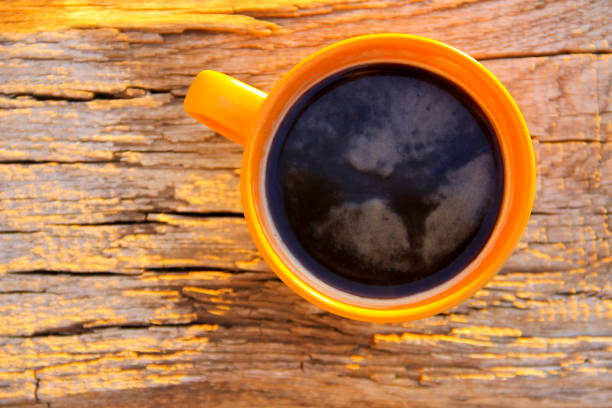 istock Cup of coffee on wooden table. Top view 660034436