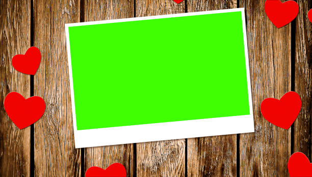top view of decorative red hearts with photo frame with chroma key green screen on old wood background top view of decorative red hearts with photo frame with chroma key green screen on old wood background concept of love valentine day, wedding chroma key photos stock pictures, royalty-free photos & images