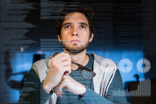 istock Handsome young man working with laptop in his office at night. 660051620