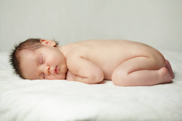 istock Sleeping baby, up to one month, newborn on background 660060078