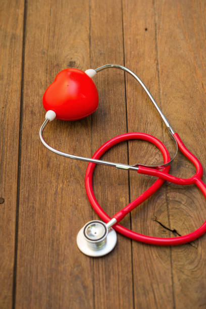 istock Stethoscope with red heart on a wood background. 660070176