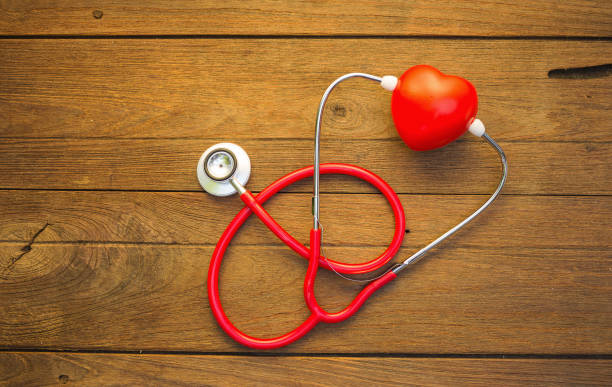 istock Stethoscope with red heart on a wood background. 660070230