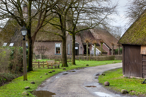 Street with historic farms and barns in Orvelte in the Netherlands