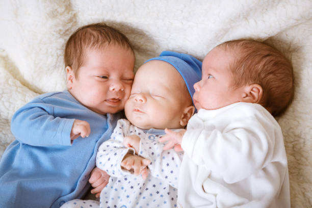 Newborn triplets boys Portrait of newborn triplets - boys close up blue brothers stock pictures, royalty-free photos & images