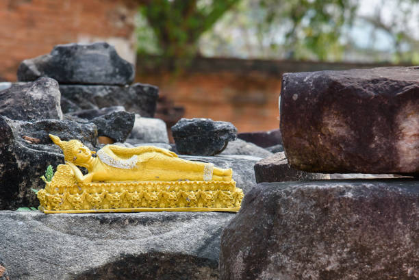 Ayutthaya, Thailand - March, 12, 2017 : Broken Buddha statue dumped at Wat Mahathat, Ayutthaya, Thailand.