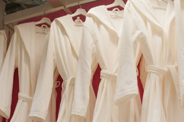 istock White terry robes in the closet 660111026